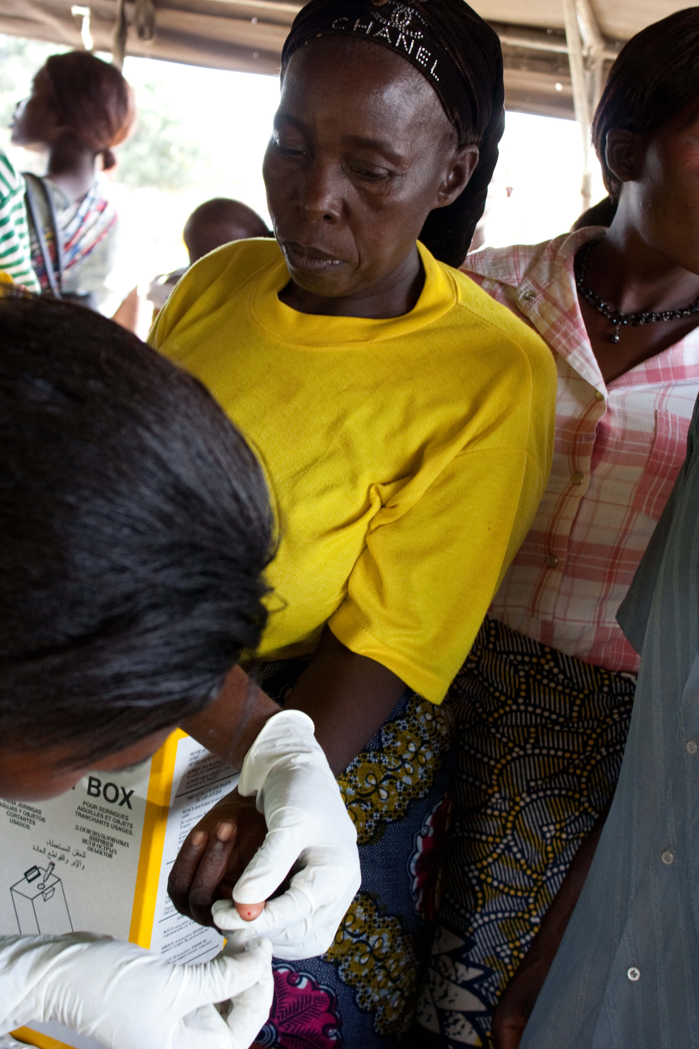 A patient in Zambia receives a malaria diagnostic test. PATH/Gena Morgan