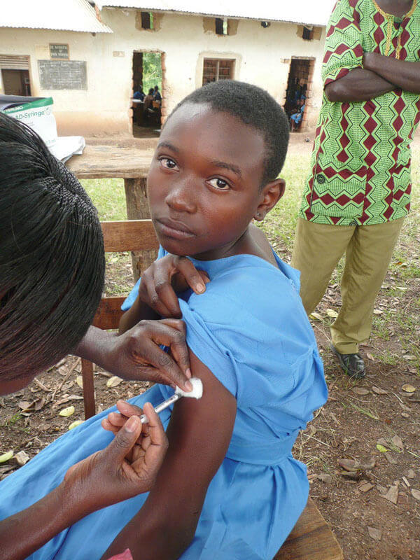 Child receiving a vaccine. Photo: PATH/Robin Biellik