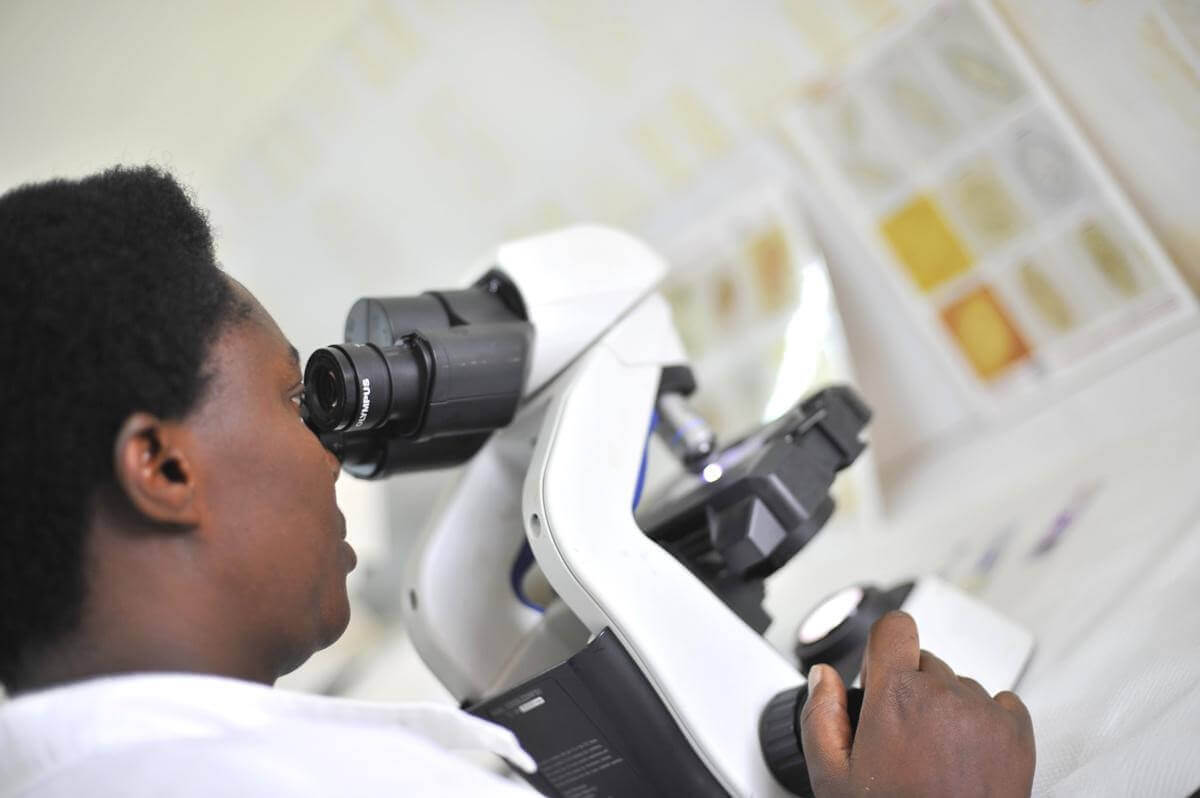 Photo caption and credits: A lab technician in Rwanda. Riccardo Gangale for USAID/ Courtesy of Photoshare	