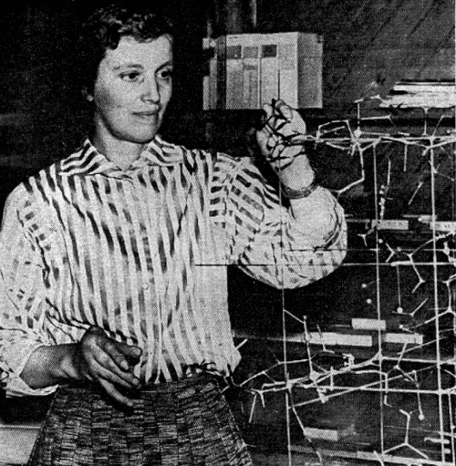 Dorothy Hodgkin demonstrates the structure of vitamin B12 with a model. Photo: C&EN Archives
