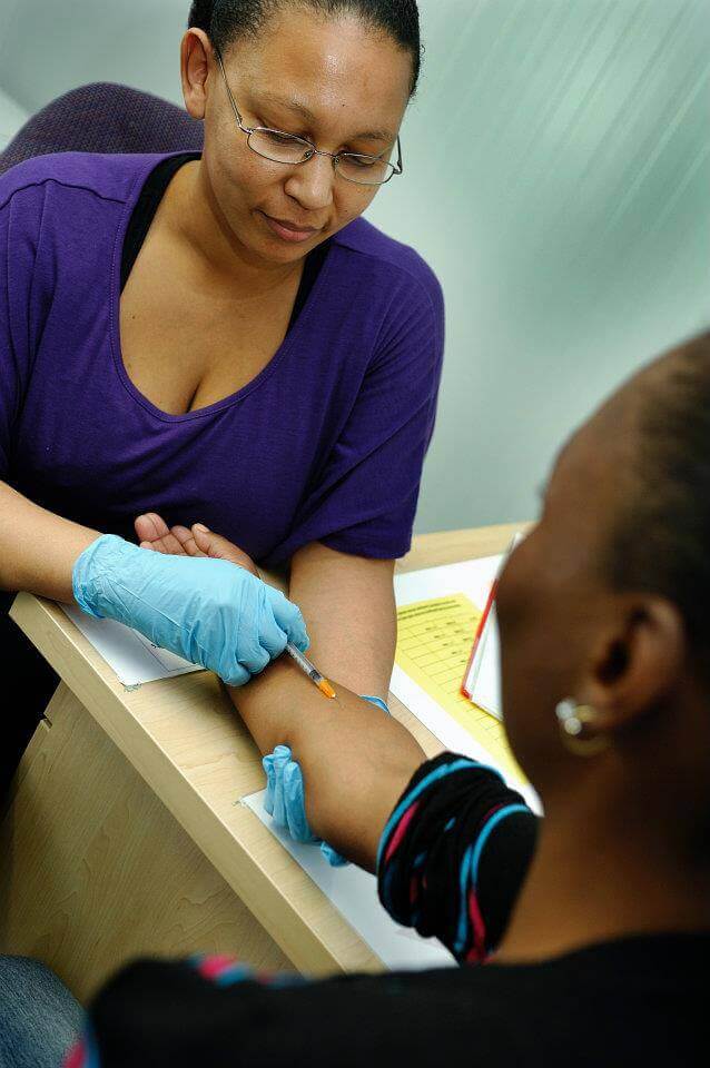 A researcher conducting a vaccine clinical trial. Photo: AERAS